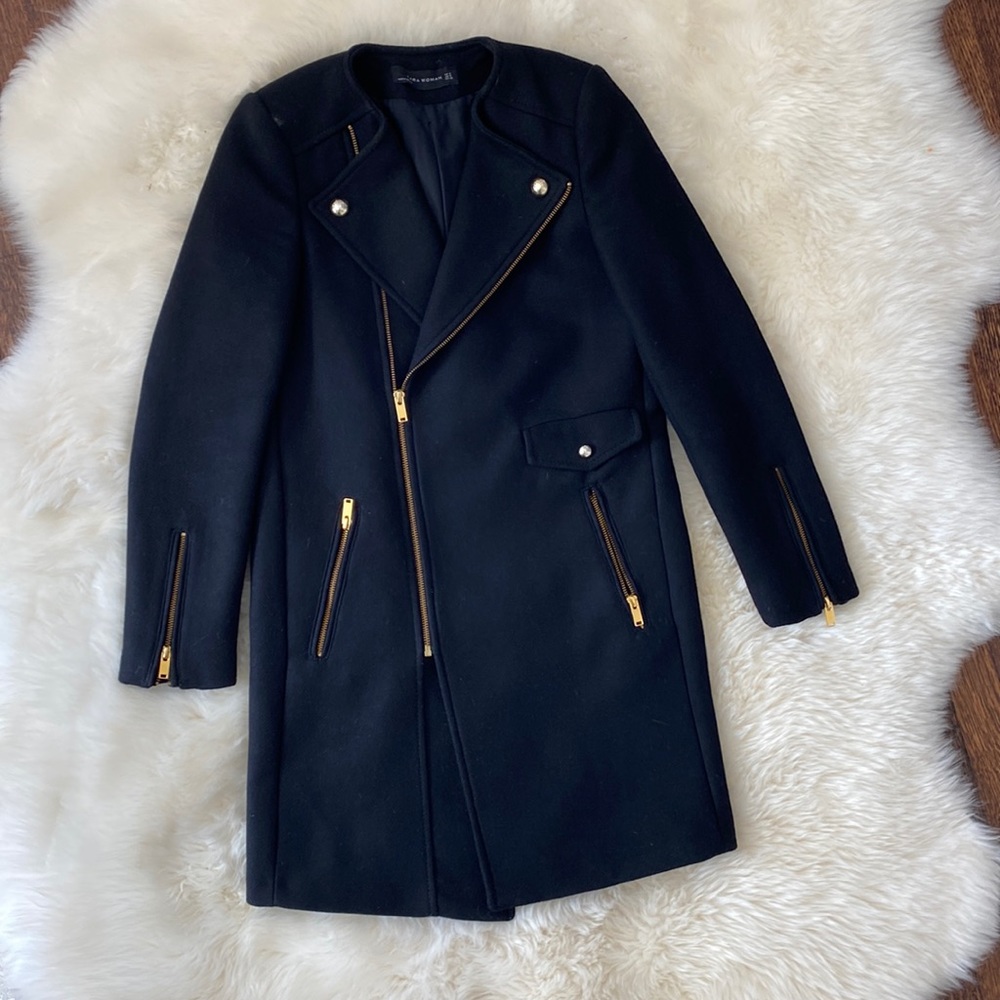 Women’s wool coat gently worn still in great condition. Black with gold Zippers.